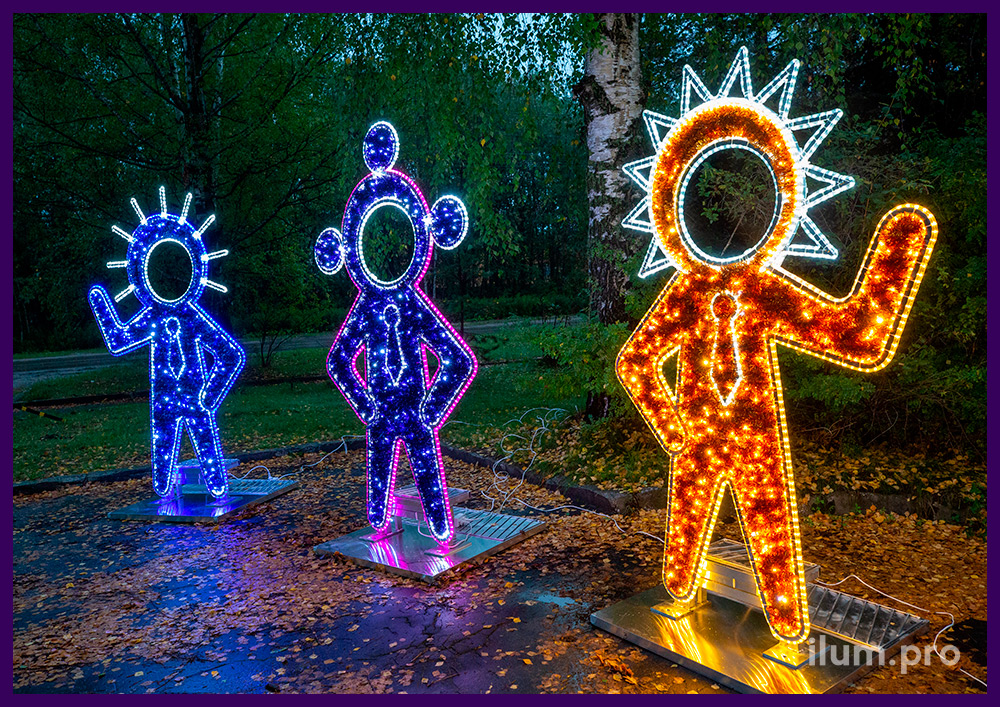 Декоративная фотозона с подсветкой в форме детских тантамаресок инопланетян с гирляндами и мишурой